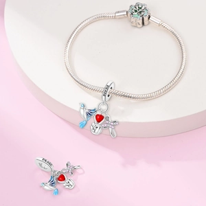 Macro detail of S925 style Peace and Hope angel charms with colorful enamel and crystals