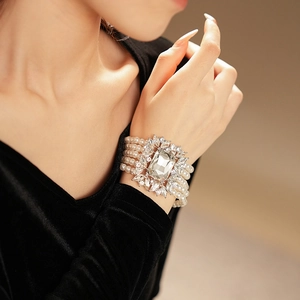 Detail of a four-row pearl bracelet with a large rectangular crystal and silver finish