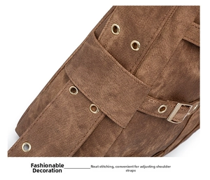 Detail of vintage brown canvas tote bag featuring metal eyelets and neat stitching