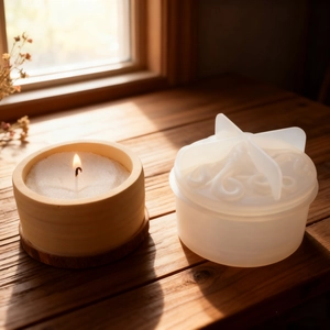 Silicone mold for DIY octopus jar with finished candle on a sunlit wooden windowsill