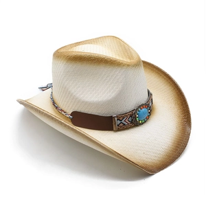 Detail of western cowboy straw hat featuring turquoise ornament and woven decorative band