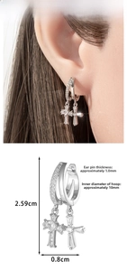 Detail view of silver cross earrings with dimensions: height 2.59cm and 10mm inner diameter