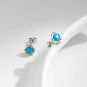 Elegant S925 silver stud earrings with square blue opal stones on a clean white background