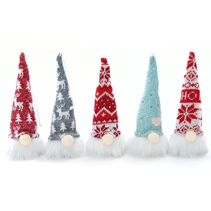 Five glowing Christmas gnomes with LED lights, knitted hats and long white faux fur beards