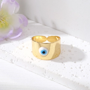 Bague large ajustable plaquée or avec emblème oeil protecteur bleu sur fond de pierre