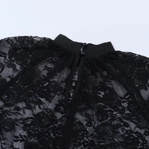 Detail of black lace top showing the back neck slit and double button closure design