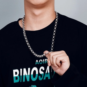 Men's silver stainless steel round link chain necklace shown worn on a black t-shirt