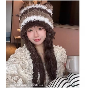 Close-up of cat ear plush beanie with striped pattern and long earflaps for women