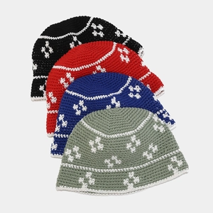 Handmade crochet floral bucket hats in four colors with contrasting white wavy trim