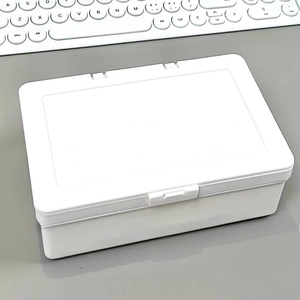 White plastic rectangular storage box with flip lid and secure latch on a grey desk