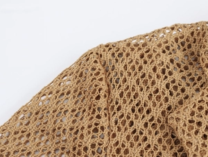 Detailed close-up showing the brown openwork knit texture and woven mesh pattern of the garment