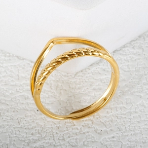 Minimalist double-layer gold plated V-shape stainless steel ring on geometric display