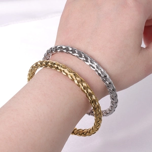 Retro twisted steel wire cuff bracelets in gold and silver finish for a minimalist look