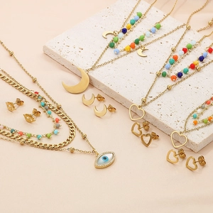 Bohemian gold stainless steel necklace set with heart, moon, and evil eye charms