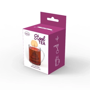 Close-up of a novelty silicone tea infuser in a funny butt shape hanging on a ceramic cup