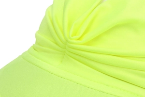 Macro view of high-visibility neon yellow breathable fabric with precision double stitching