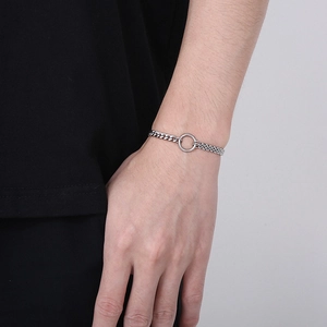Close-up of stainless steel bracelet with mixed Cuban and dense link chains on wrist