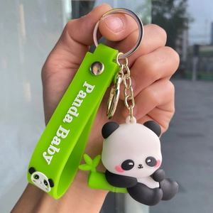 Close-up of cute panda plush keychain with green bamboo and Panda Baby wrist strap