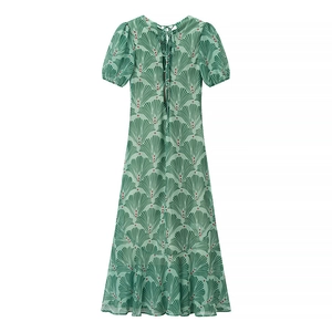 Detail of the back tie closure and puff sleeves on a green floral chiffon maxi dress