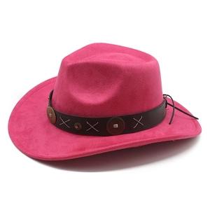 Detail of rose red western cowboy hat with brown leather band and metallic rivets decoration