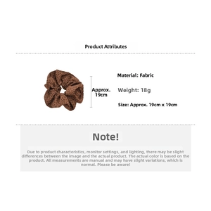 Detailed specs of the brown leopard print hair scrunchie made of fabric with size details