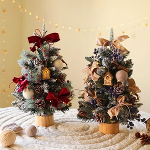 Mini tabletop Christmas trees with ornaments and wooden base in cozy home setting