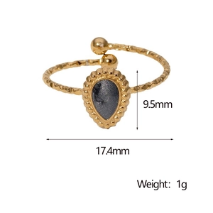 Detailed view of teardrop ring with 17.4mm diameter and hammered gold texture