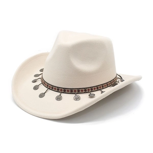 Close-up of beige western cowboy hat with ethnic woven band and silver metal pendants
