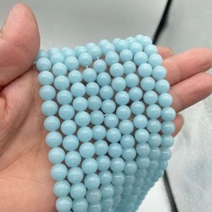 Luminous light blue round stone beads for DIY jewelry making and glowing accessories