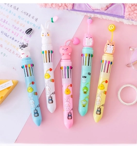 Close-up of five colorful multi-color ballpoint pens with 3D cute cartoon animal toppers