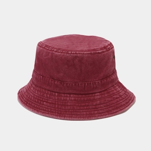 Detail view of burgundy washed cotton bucket hat with parallel stitching and air vent