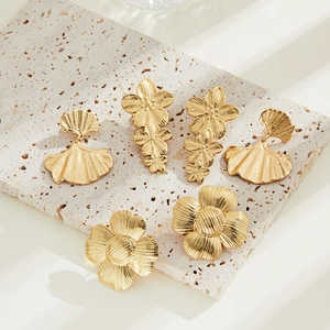 Elegant 18K gold-plated stainless steel ginkgo leaf stud earrings on stone texture