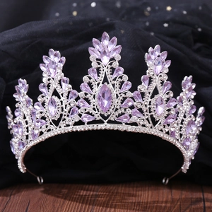 Macro shot of silver bridal crown featuring purple marquise crystals and clear rhinestones