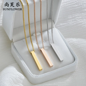 Detailed view of three minimalist stainless steel bar necklaces in gold, silver, and rose gold