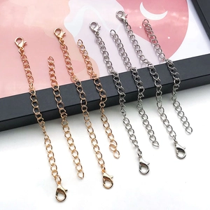 Detail of DIY keychain lobster clasp extension chains in gold and silver finishes