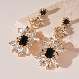Luxurious gold flower drop earrings with black rectangular crystals and shiny rhinestones