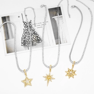 Silver tennis necklace with gold plated star pendant encrusted with white zircon stones