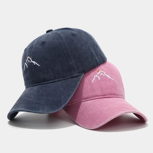 Washed cotton baseball cap with minimalist mountain embroidery in navy and pink