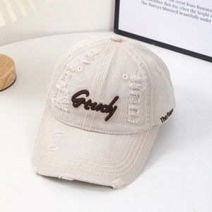 Vintage beige baseball cap with Study embroidery and distressed ripped details on brim