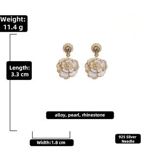 Detail view of pearl camellia flower earrings with size and material specifications