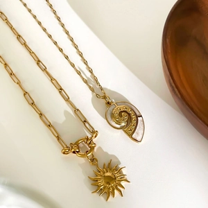Vintage gold sunflower and conch shell pendant necklaces with shell inlay detail