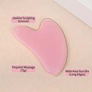 Pink heart-shaped facial gua sha tool set for jawline firming and body massage in a gift box
