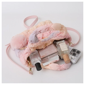 Top view of plush gradient crossbody bag showing spacious interior with personal items