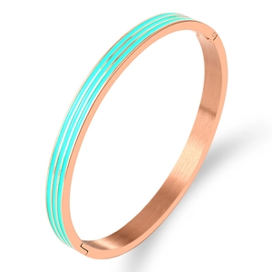 Detail showing rose gold steel bracelet with turquoise enamel inlay and brushed texture