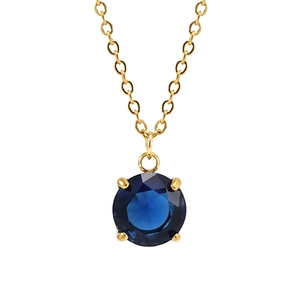 Detail eines runden tiefblauen Zirkon-Anhängers mit goldener Vier-Krallen-Fassung