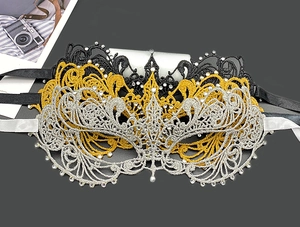 Top view of hollow lace masquerade masks with rhinestones in black, gold and silver colors