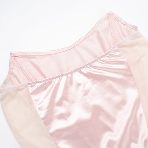 Detailed view of pink satin and mesh splicing on a bodycon evening dress
