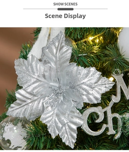 Close-up of glitter silver Christmas poinsettia flower on a festive tree branch