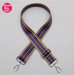 Detail of adjustable ethnic style strap with blue red pattern and silver metal clips