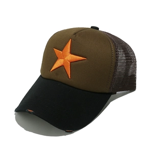 Detail of 3D star embroidery and distressed brim on a mesh-back trucker hat